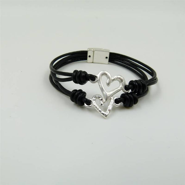 Contrasting smooth & beaten heart on leather bracelet