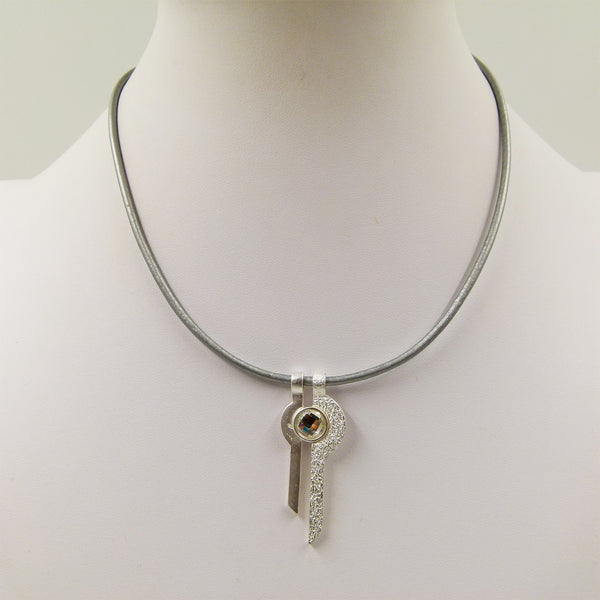 Key style pendant with crystal on short leather necklace