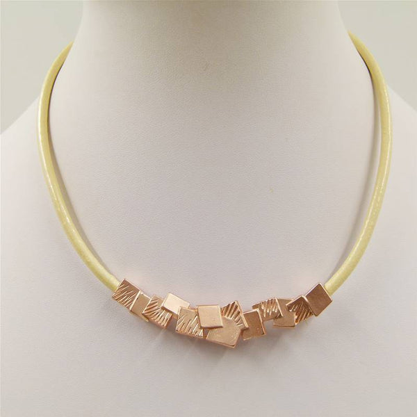 Mini squares with scratch detail on short leather necklace