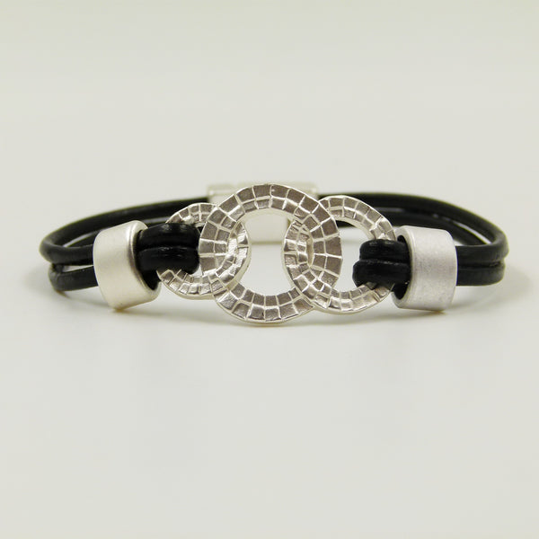 Detailed interlinked circles on twin leather bracelet