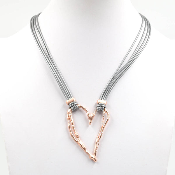 Irregular cutout heart pendant on short multistrand leather