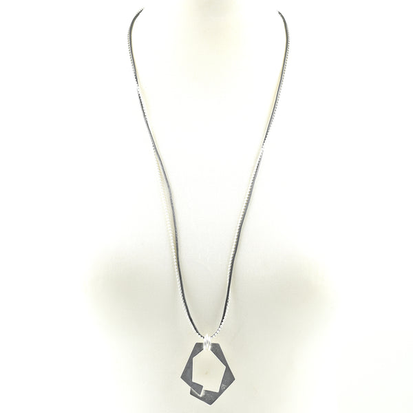 Geometric cut out shape on leather and chain necklace