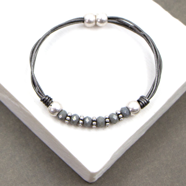 Leather cord bracelet with central silver & grey beads 