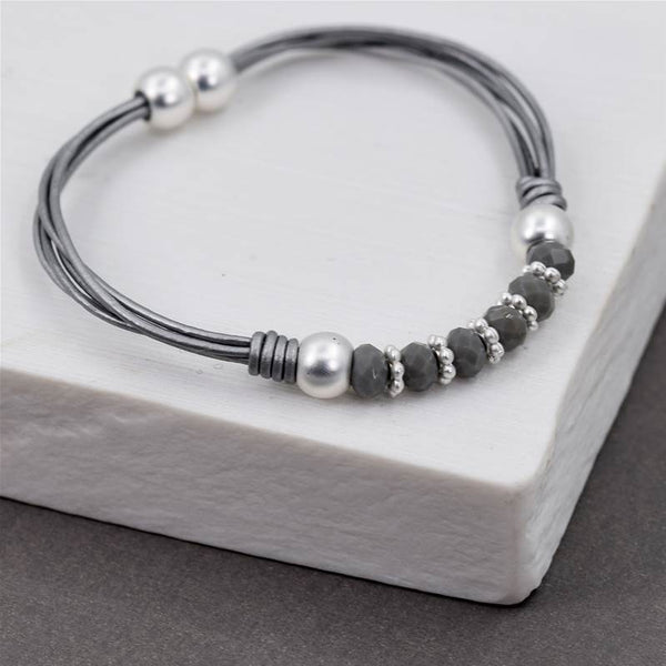 Leather cord bracelet with central silver & grey beads 