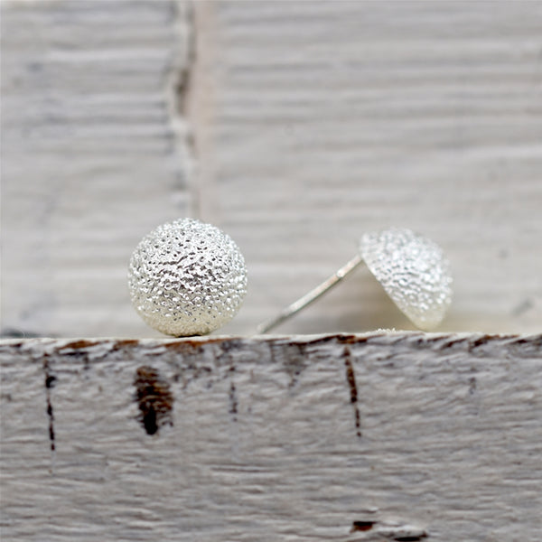 Dappled effect rounded stud earrings