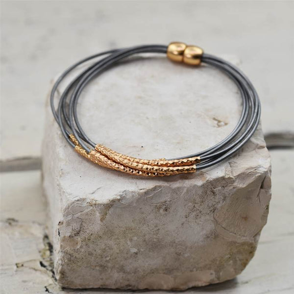 Delicate leather bracelet with fine tube components