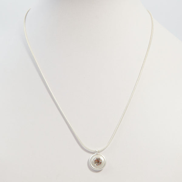 Snake chain necklace w/ circle & stone pendant