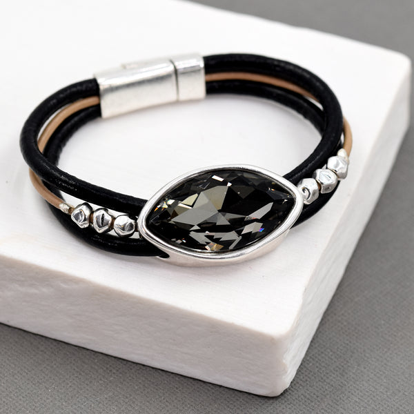 Triple strand leather bracelet with crystal pendant