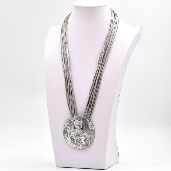 Long silk cord necklace with metallic shell statement pendant